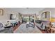 Bright and airy living room featuring a cozy seating area and a view of the backyard at 3980 Sunset Lake Dr, Lakeland, FL 33810