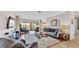 Spacious living room with comfortable seating, a large rug, and access to the outdoor patio at 3980 Sunset Lake Dr, Lakeland, FL 33810