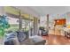 Bright living room with a view of the screened-in lanai and beautiful backyard at 3980 Sunset Lake Dr, Lakeland, FL 33810