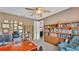 Well-lit office space with built-in bookshelves and a large desk, perfect for working from home at 3980 Sunset Lake Dr, Lakeland, FL 33810
