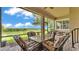 Relaxing screened patio with comfortable seating and views of the serene landscape at 3980 Sunset Lake Dr, Lakeland, FL 33810