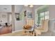Relaxing sitting area with wingback chairs next to a chess table with lots of natural light at 3980 Sunset Lake Dr, Lakeland, FL 33810
