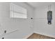 This basement features a window, painted concrete block, and utility access at 408 Sycamore Sw St, Fort Meade, FL 33841