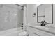 Beautiful bathroom with a shower and tub combo, black fixtures, and a granite vanity at 408 Sycamore Sw St, Fort Meade, FL 33841
