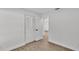 This bedroom features wood-look floors, white walls, and a closet at 408 Sycamore Sw St, Fort Meade, FL 33841
