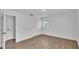 This bedroom features wood-look floors, white walls, and a closet at 408 Sycamore Sw St, Fort Meade, FL 33841