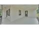 Side view of a newly renovated home showcasing its spacious covered carport area and exterior paint at 408 Sycamore Sw St, Fort Meade, FL 33841
