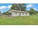Charming single story home with a side carport, neutral exterior, and well-maintained landscape at 408 Sycamore Sw St, Fort Meade, FL 33841
