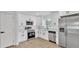 Modern kitchen showcasing white cabinets, stainless steel appliances, and contemporary countertops, all newly updated at 408 Sycamore Sw St, Fort Meade, FL 33841