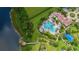 Aerial view of a community pool and gazebo near a lake at 4125 Prima Lago Cir, Lakeland, FL 33810