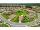 Overview of a residential area with well-maintained homes and green spaces from above at 4125 Prima Lago Cir, Lakeland, FL 33810