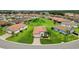 Stunning aerial view of a beautifully landscaped property in a quiet neighborhood at 4125 Prima Lago Cir, Lakeland, FL 33810