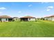 Expansive backyard featuring lush green grass and a well-manicured lawn at 4125 Prima Lago Cir, Lakeland, FL 33810