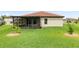 A spacious backyard with a screened-in porch offers the perfect outdoor retreat at 4125 Prima Lago Cir, Lakeland, FL 33810