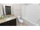 Full bathroom featuring a granite countertop vanity, toilet, and tub/shower combo at 4125 Prima Lago Cir, Lakeland, FL 33810