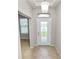 Welcoming foyer featuring tiled floors, decorative door, and natural light at 4125 Prima Lago Cir, Lakeland, FL 33810