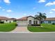 Charming single-story home with a well-manicured lawn and brick-paved driveway at 4125 Prima Lago Cir, Lakeland, FL 33810