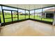 Bright screened-in lanai offering peaceful views of the well-manicured backyard and neighborhood at 4125 Prima Lago Cir, Lakeland, FL 33810