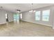 Bright living room with large windows and tile flooring at 4125 Prima Lago Cir, Lakeland, FL 33810