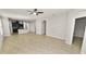 Expansive living area with tile flooring flowing into the adjacent kitchen and dining space at 4125 Prima Lago Cir, Lakeland, FL 33810