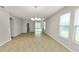 Bright living room with large windows and tile flooring at 4125 Prima Lago Cir, Lakeland, FL 33810
