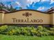 Terra Largo community sign surrounded by colorful flowers and greenery at 4125 Prima Lago Cir, Lakeland, FL 33810
