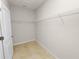 A small walk-in closet includes installed storage shelving at 4125 Prima Lago Cir, Lakeland, FL 33810