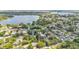 Aerial shot showcasing neighborhood homes near a lake with lush green landscaping at 416 Bayou Rd, Winter Haven, FL 33884