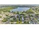 Expansive view of a residential area featuring a large lake surrounded by lush greenery and well-maintained homes at 416 Bayou Rd, Winter Haven, FL 33884