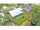 Spacious backyard featuring an outdoor seating area, a trampoline, and well-maintained landscaping by a tranquil canal at 416 Bayou Rd, Winter Haven, FL 33884