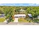 Charming single-story home featuring a new metal roof, gray garage door and beautiful landscaping from above at 416 Bayou Rd, Winter Haven, FL 33884