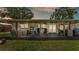 Spacious covered patio perfect for outdoor lounging and entertaining with stylish furniture and ceiling fans at 416 Bayou Rd, Winter Haven, FL 33884