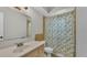 Bathroom featuring a floral shower curtain and classic sink and toilet at 416 Bayou Rd, Winter Haven, FL 33884