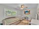 bedroom with a crib and a bed, along with toys and decorations at 416 Bayou Rd, Winter Haven, FL 33884
