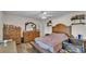 Cozy bedroom with wooden furniture, a comfortable bed, and ample natural light at 416 Bayou Rd, Winter Haven, FL 33884