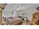 Bright bedroom includes wood floors, closet with paneled doors, ceiling fan, and backyard view at 416 Bayou Rd, Winter Haven, FL 33884