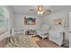bedroom featuring a crib, a bed and a window that provides natural light at 416 Bayou Rd, Winter Haven, FL 33884