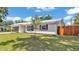 Charming single-story home featuring a well-maintained front yard and metal roof at 416 Bayou Rd, Winter Haven, FL 33884