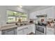 Functional kitchen featuring stainless steel appliances and a view to the outdoors at 416 Bayou Rd, Winter Haven, FL 33884