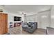 Inviting living room with gray sofa, fireplace, and wood-look flooring at 416 Bayou Rd, Winter Haven, FL 33884