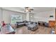 Comfortable living room featuring a large gray sectional sofa and ample natural light at 416 Bayou Rd, Winter Haven, FL 33884