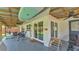 Large covered patio with furniture and outdoor accessories at 416 Bayou Rd, Winter Haven, FL 33884
