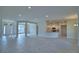 Expansive living space with tile floors, recessed lighting, and seamless transition to kitchen at 4306 Juliana Lake Dr, Auburndale, FL 33823