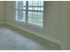 Large window providing ample natural light and a serene view of the outdoor landscape at 4306 Juliana Lake Dr, Auburndale, FL 33823