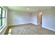Bright bedroom featuring neutral carpet, a window offering natural light, and ample space at 4312 Juliana Lake Dr, Auburndale, FL 33823
