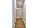 Efficient walk-in closet with wood-look tile flooring and shelving perfect for organization at 4312 Juliana Lake Dr, Auburndale, FL 33823