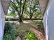 Expansive backyard featuring mature trees and lush greenery, offering a serene and private outdoor space at 4535 Weston Ct, Bartow, FL 33830