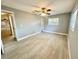 Light-filled bedroom with wood-look floors and ceiling fan at 4535 Weston Ct, Bartow, FL 33830