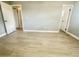 Bright bedroom with wood-look floors and multiple doorways at 4535 Weston Ct, Bartow, FL 33830