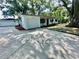 Charming single-story home with a well-manicured lawn, mature trees, and a long driveway at 4535 Weston Ct, Bartow, FL 33830